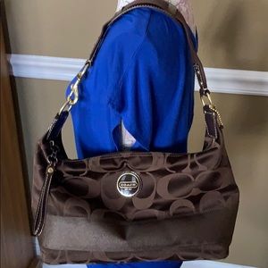 A brown Coach purse.